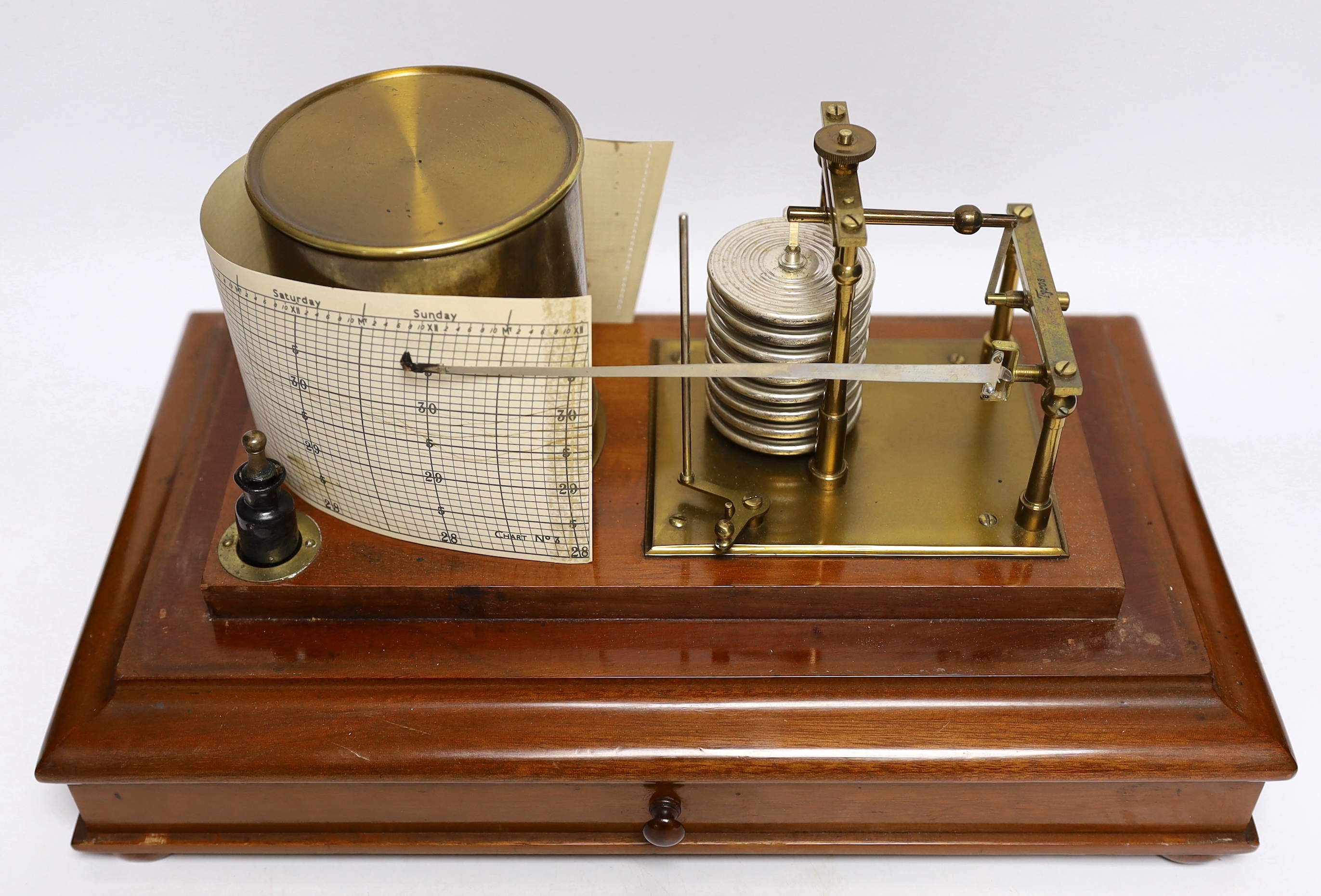 A 20th century barograph by Tycos, in a mahogany case with bevelled glass panels and incorporating an ink bottle and a drawer with spare graph papers, 36.5cm x 21.5cm